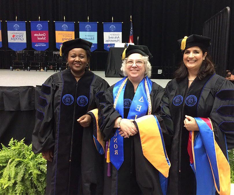 Doctoral graduate group photo at commencement.